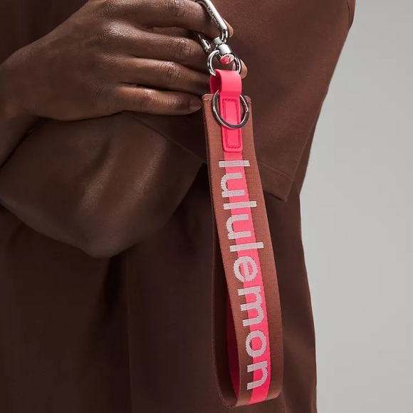 Never Lost Keychain Word-mark Color Ancient Copper/Glaze Pink/White, NWT, Unisex - Picture 2 of 3